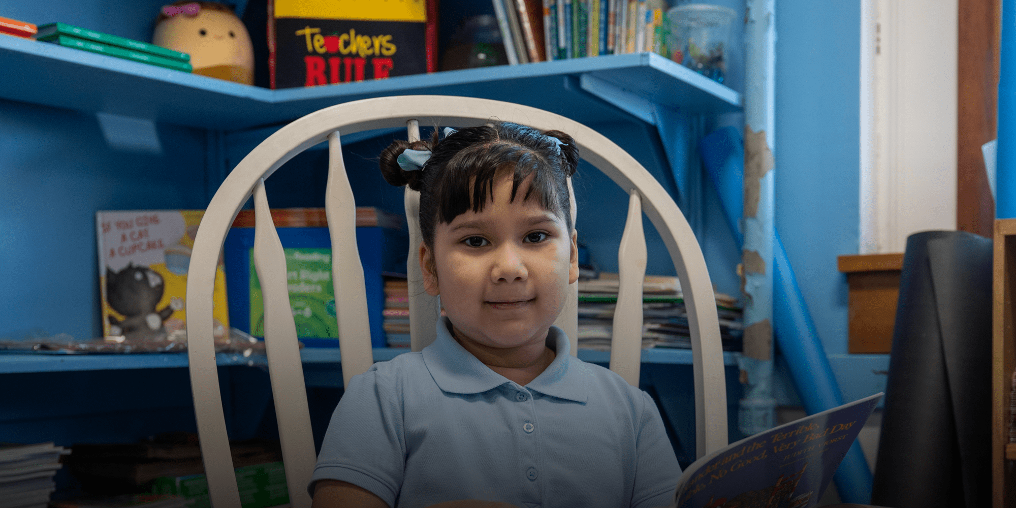 Student reading in chair